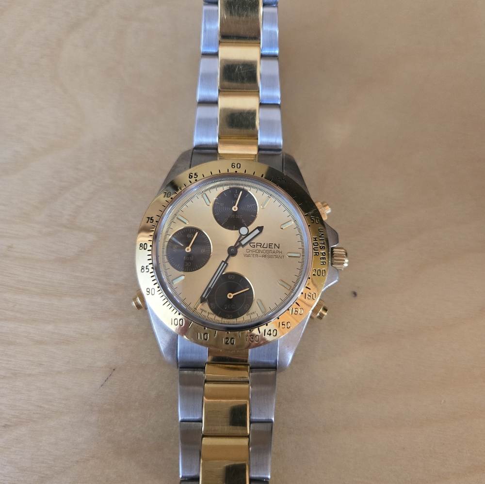 Gruen chronograph champagne sunburst dial. Two-tone watch.